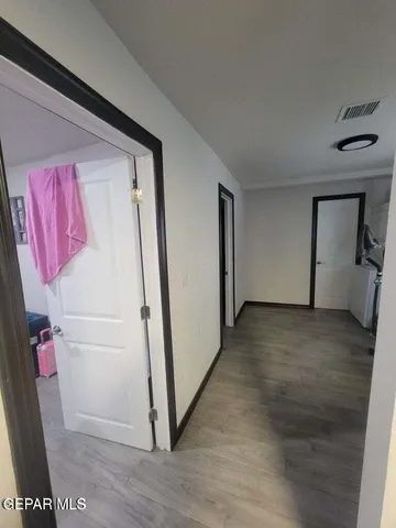 a bedroom with a bed and a potted plant