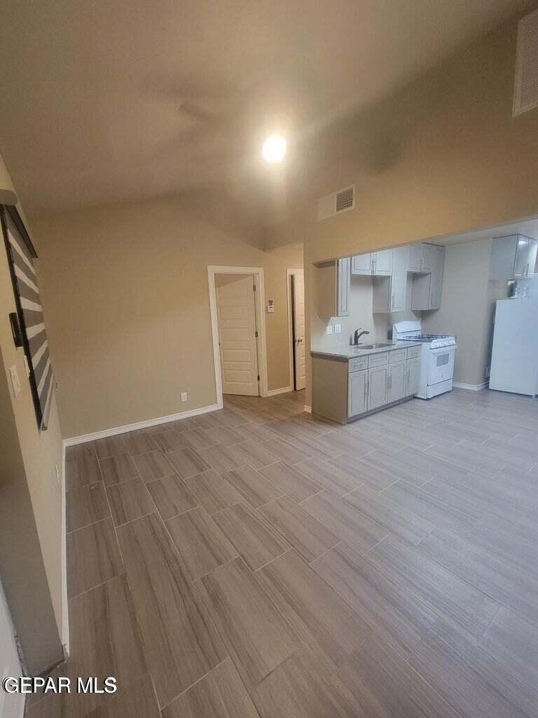 11531 Ernest Road Socorro, TX 79927 - Photo 5 of 36 a view of a kitchen with furniture and wooden floor