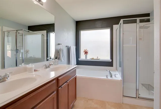 a bathroom with a bathtub and a sink