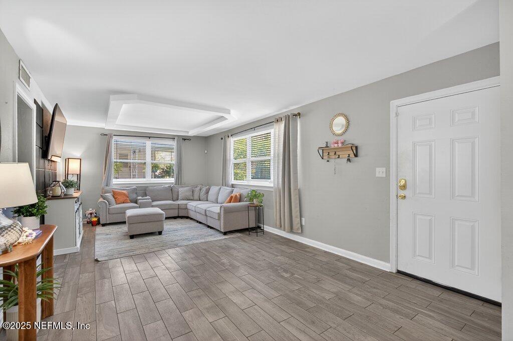 1860 Embassy Drive Jacksonville, FL 32207 - Photo 28 of 53 a living room with furniture window and wooden floor