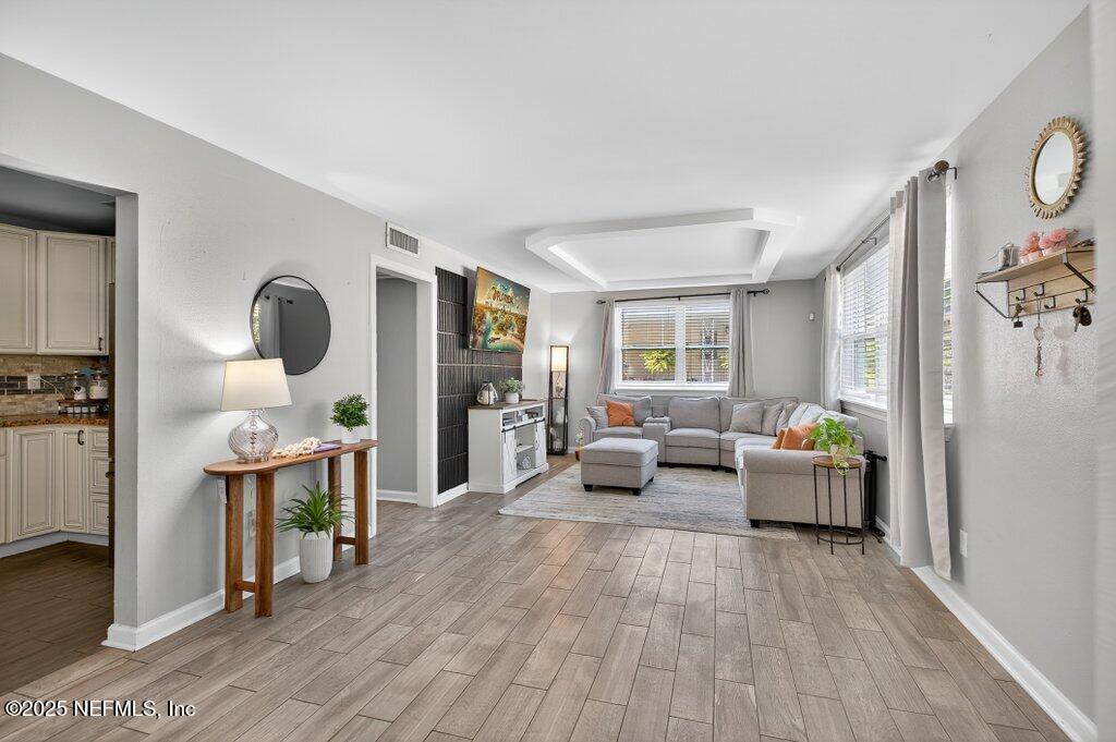 1860 Embassy Drive Jacksonville, FL 32207 - Photo 29 of 53 a living room with furniture and wooden floor