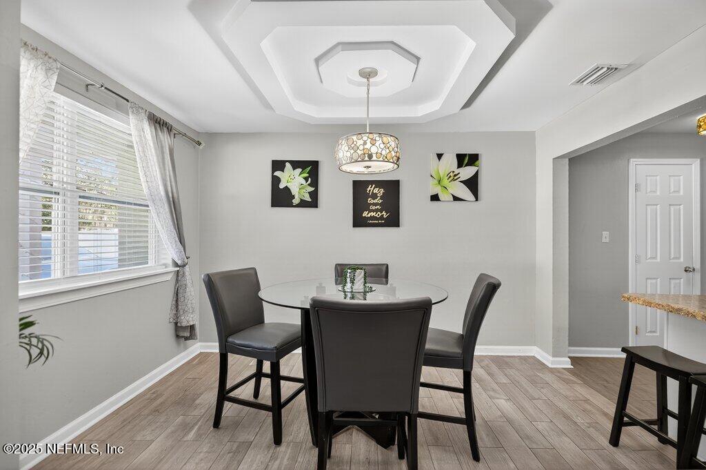 1860 Embassy Drive Jacksonville, FL 32207 - Photo 30 of 53 a view of a dining room with furniture window and wooden floor