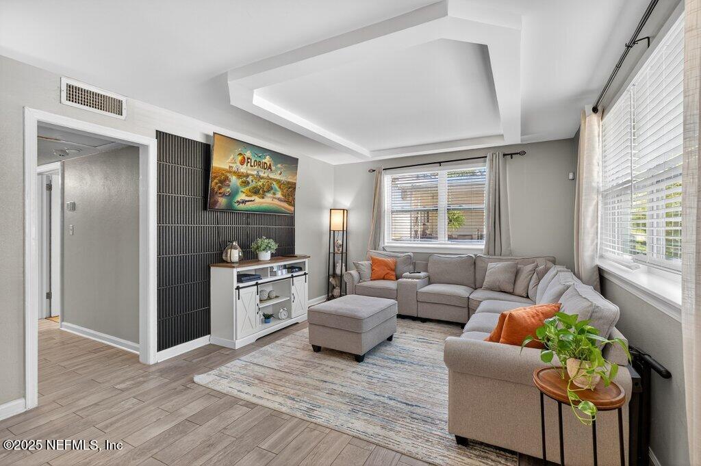 1860 Embassy Drive Jacksonville, FL 32207 - Photo 3 of 53 a living room with furniture and a flat screen tv