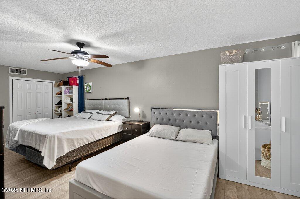 1860 Embassy Drive Jacksonville, FL 32207 - Photo 4 of 53 a bedroom with two beds and a chandelier