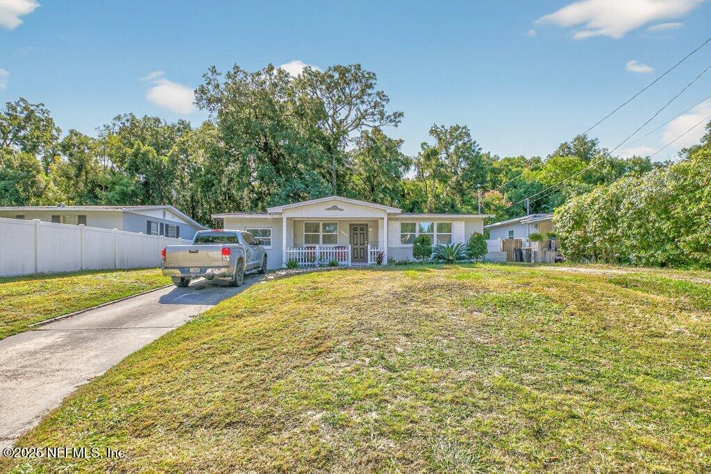 1860 Embassy Drive Jacksonville, FL 32207 - Photo 8 of 53 a view of a house with pool and a yard
