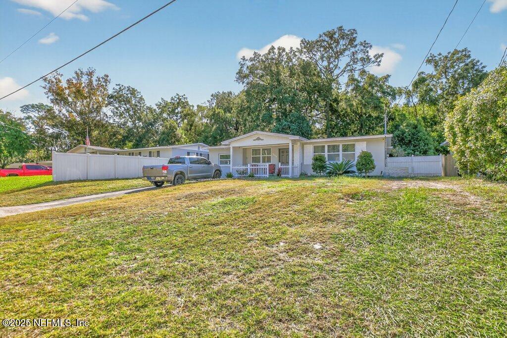 1860 Embassy Drive Jacksonville, FL 32207 - Photo 9 of 53 a view of a house with a yard balcony and a basket ball poll