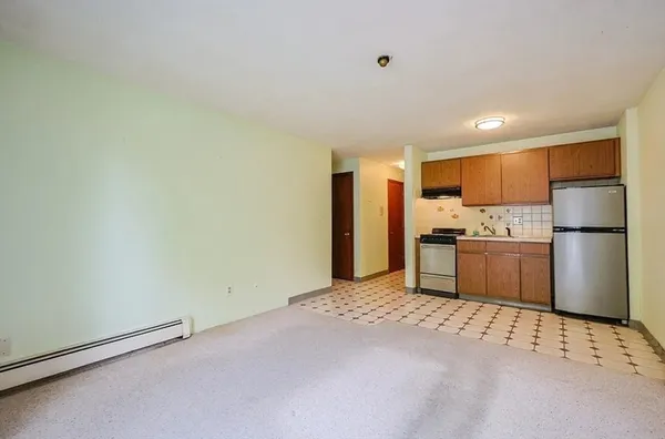 a kitchen with stainless steel appliances a refrigerator and a sink