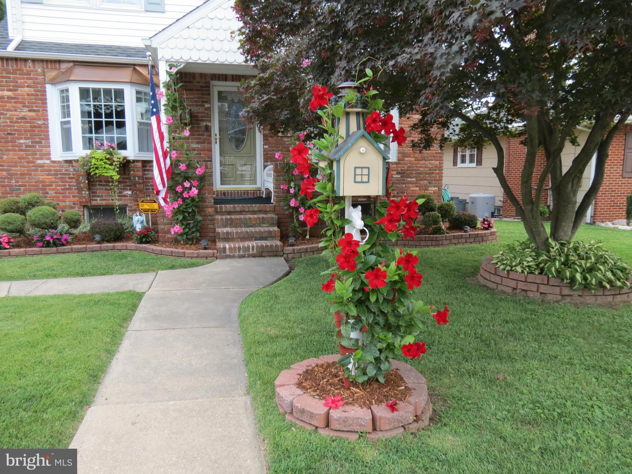 323 Nicholson Road Baltimore, MD 21221 - Photo 2 of 30 a front view of a house with a yard and fountain