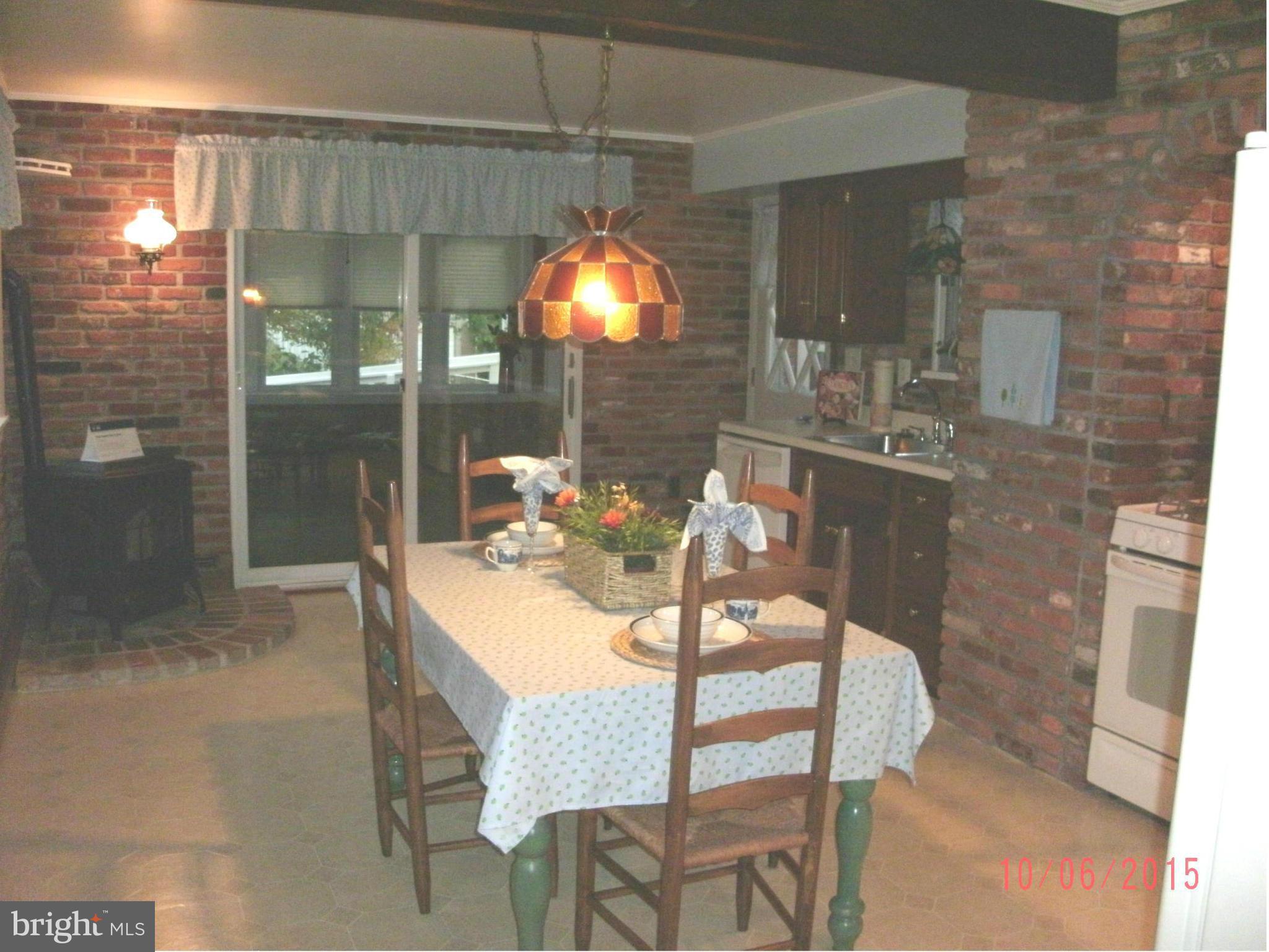 323 Nicholson Road Baltimore, MD 21221 - Photo 13 of 30 a view of a dining room with furniture and chandelier fan