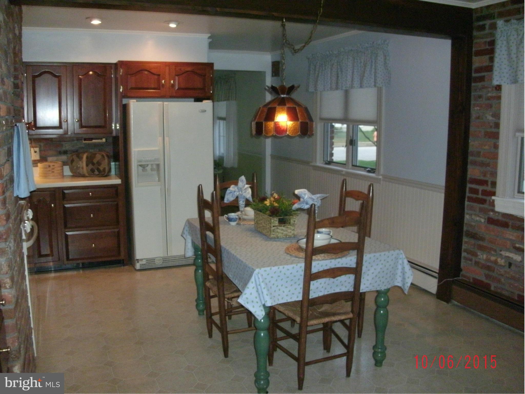 323 Nicholson Road Baltimore, MD 21221 - Photo 14 of 30 a view of a dining room with furniture and chandelier