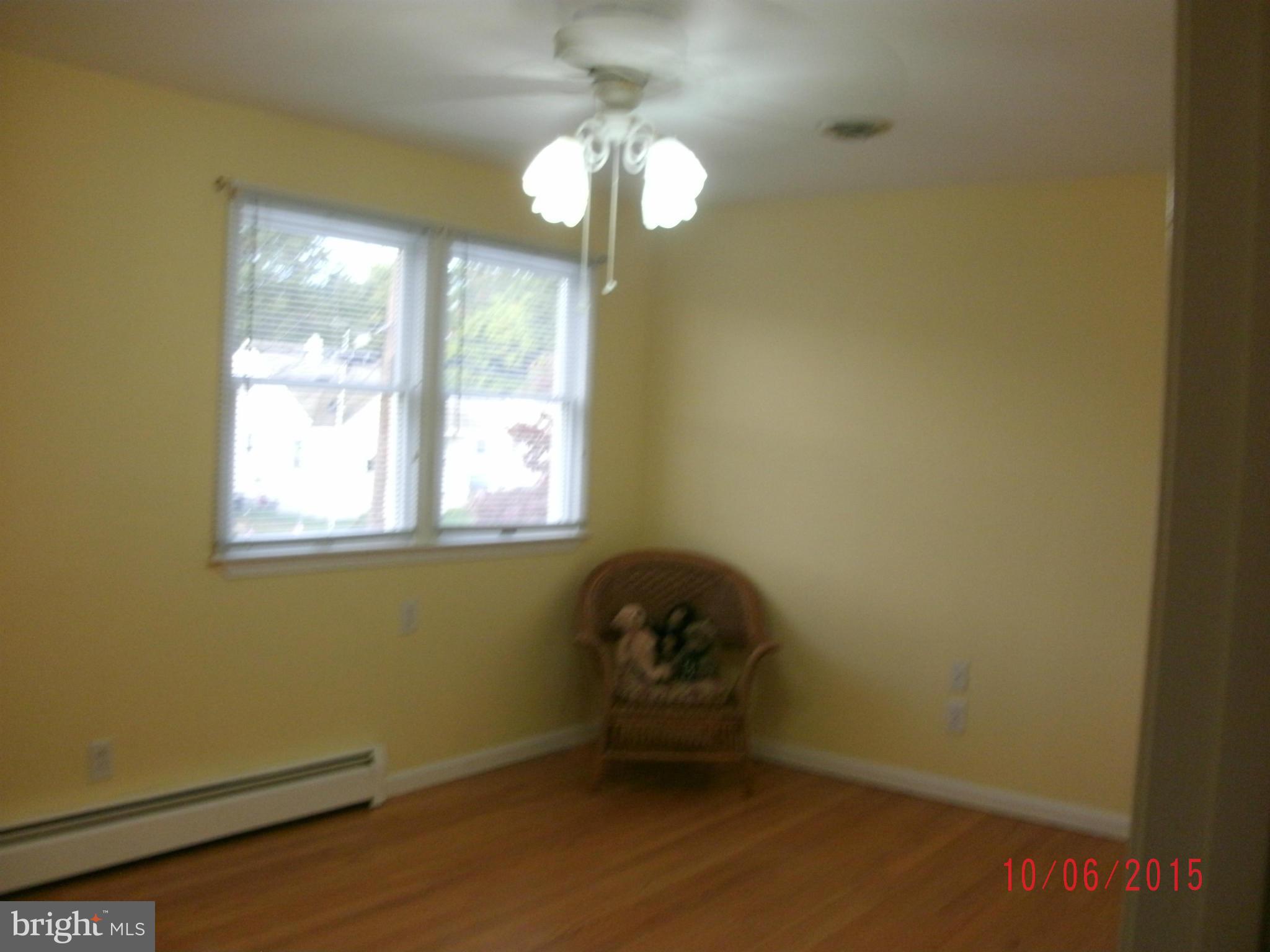 323 Nicholson Road Baltimore, MD 21221 - Photo 21 of 30 a room with a window and a chandelier