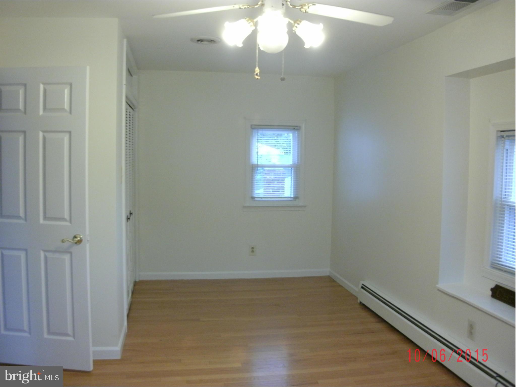 323 Nicholson Road Baltimore, MD 21221 - Photo 22 of 30 a view of empty room with wooden floor