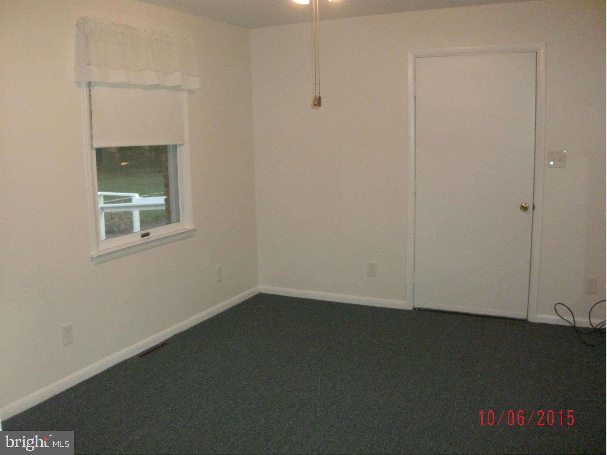 323 Nicholson Road Baltimore, MD 21221 - Photo 29 of 30 an empty room with a door