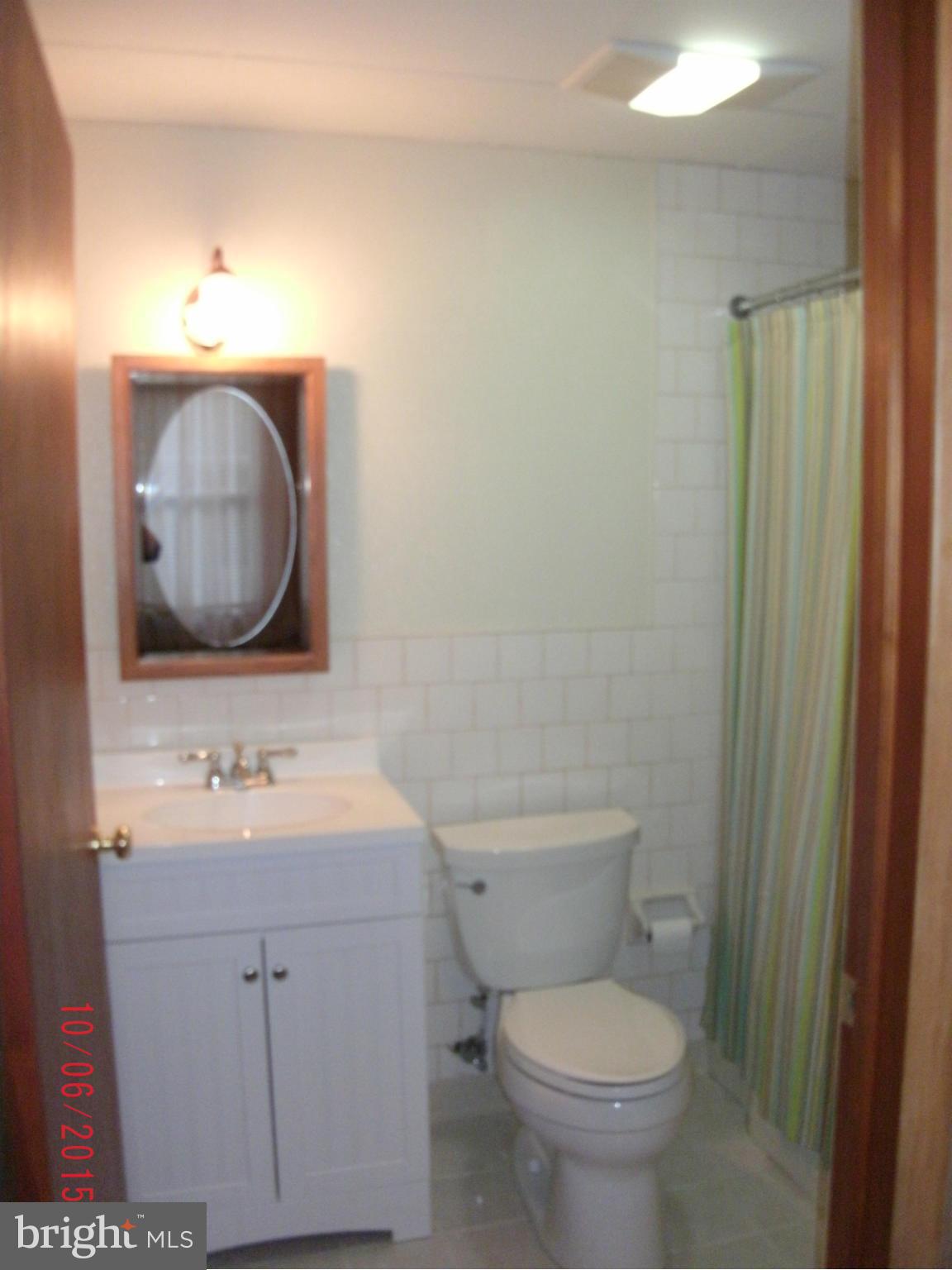 323 Nicholson Road Baltimore, MD 21221 - Photo 30 of 30 a bathroom with a toilet sink and mirror