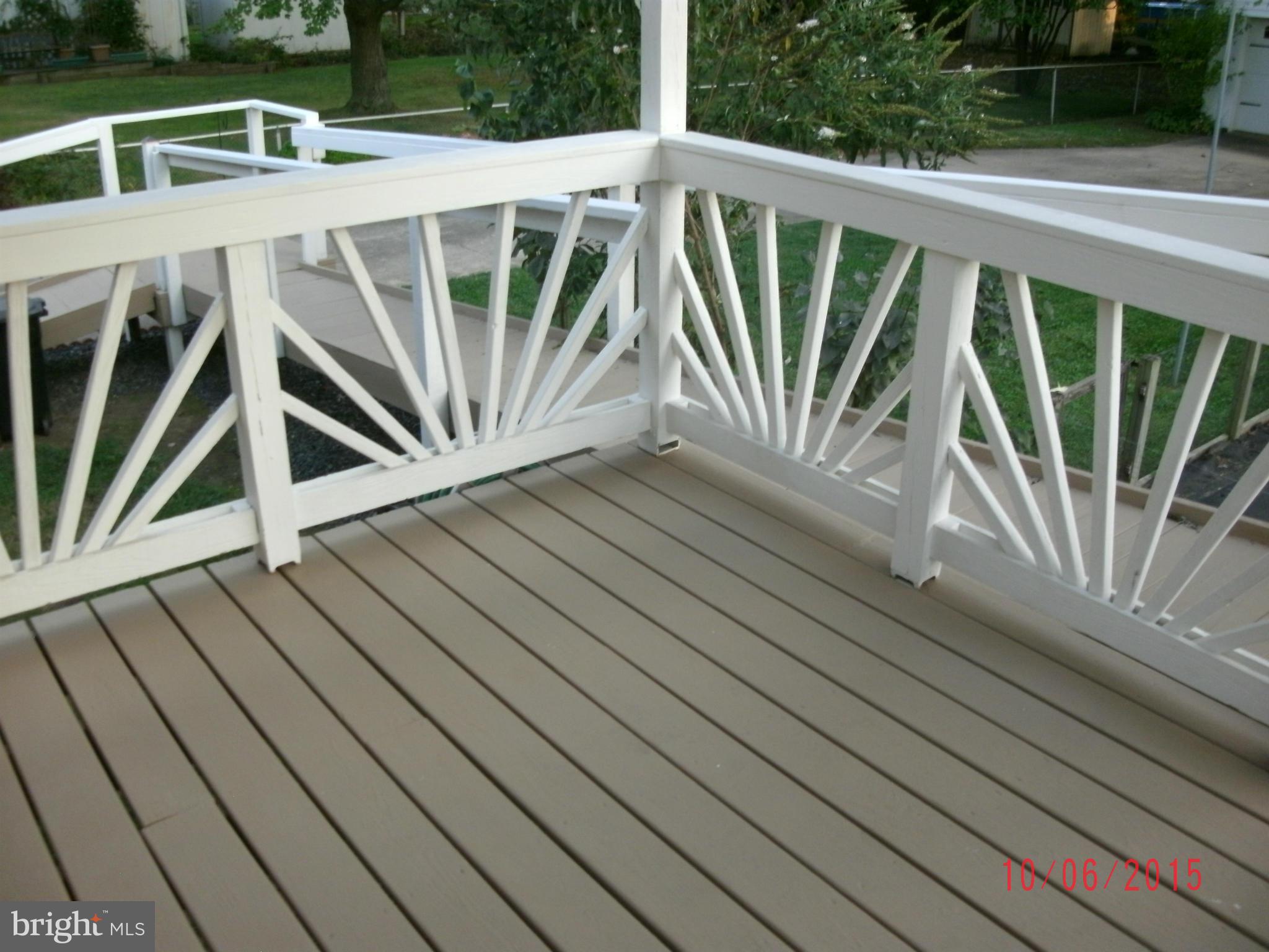 323 Nicholson Road Baltimore, MD 21221 - Photo 8 of 30 a view of deck with wooden floor and fence and a floor to ceiling window