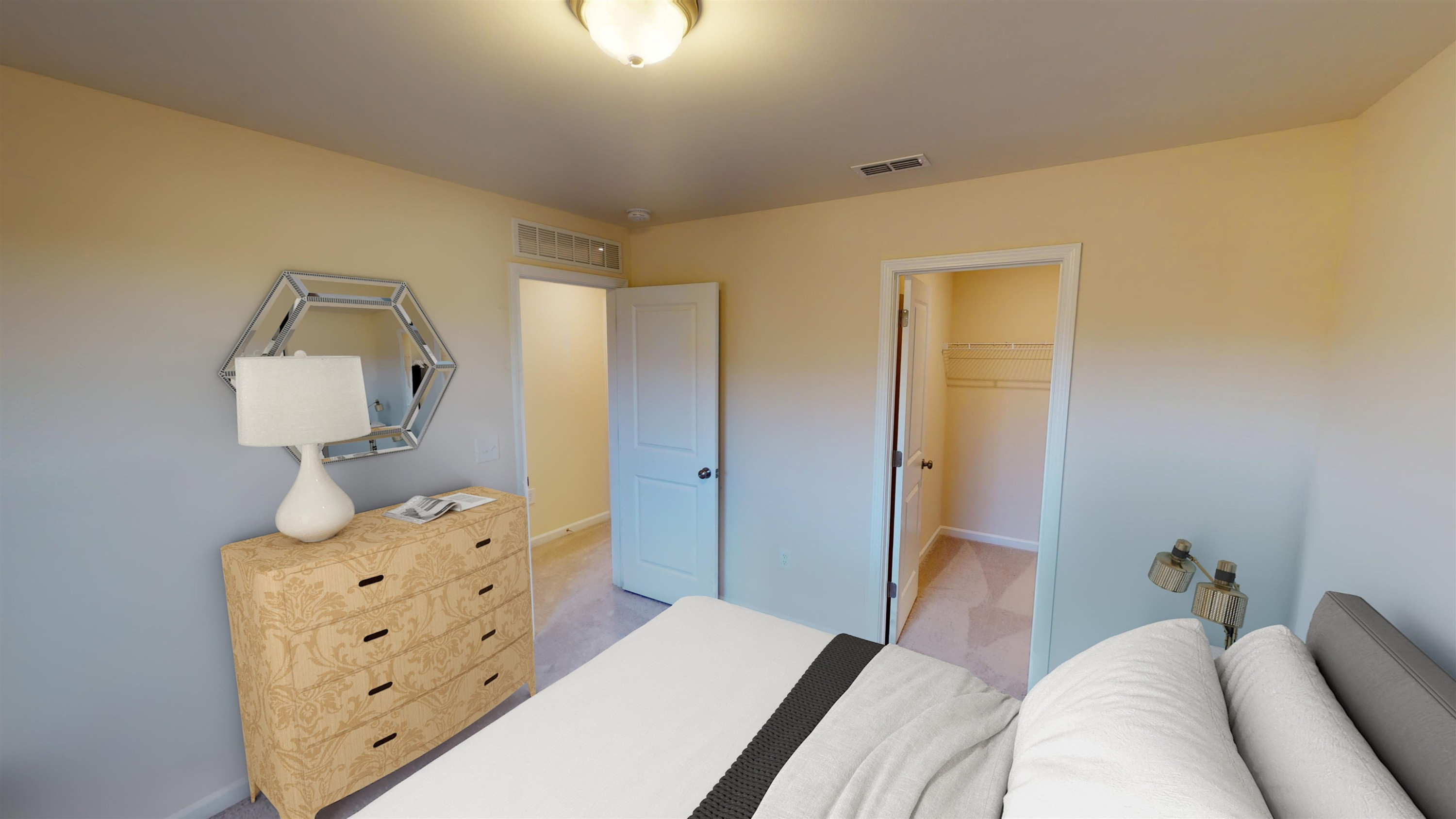 3504 Dragonfly River Raleigh, NC 27604 - Photo 18 of 27 a bedroom with a bed and wooden floor