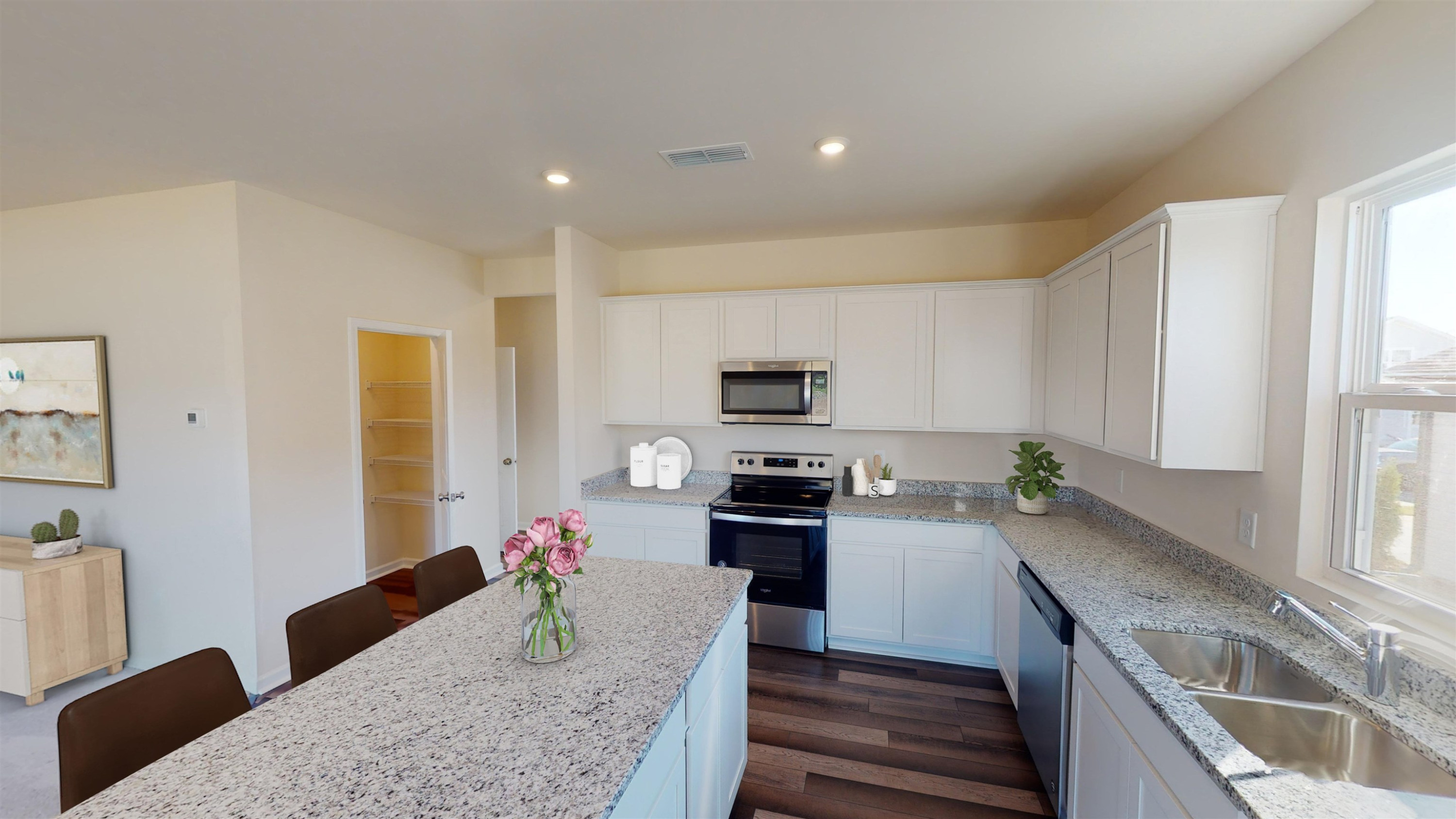 3504 Dragonfly River Raleigh, NC 27604 - Photo 7 of 27 a kitchen with granite countertop lots of counter top space and wooden floor