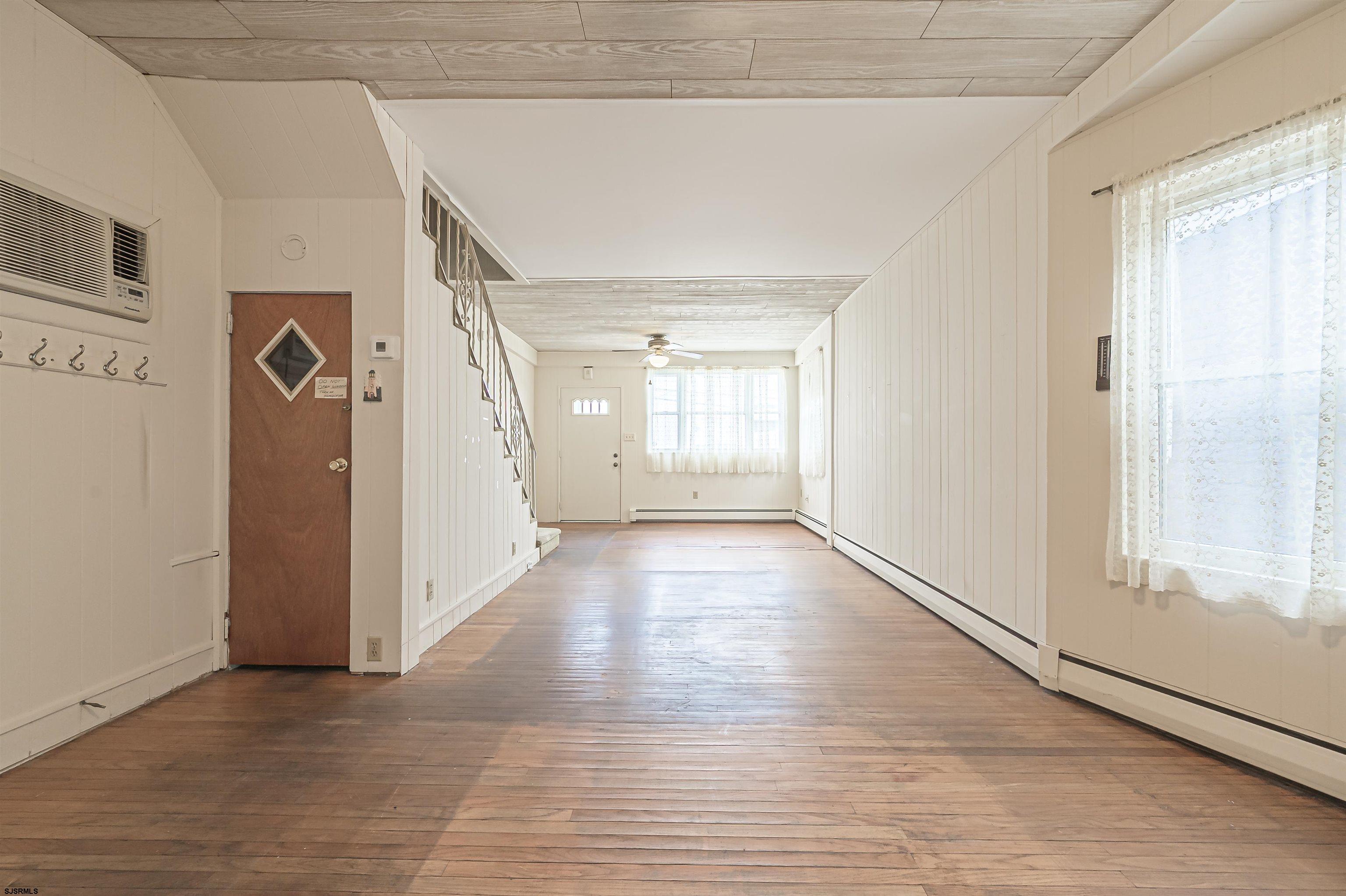 116 North Cornwall Avenue Ventnor City, NJ 08406 - Photo 12 of 28 a view of an empty room with wooden floor and a window