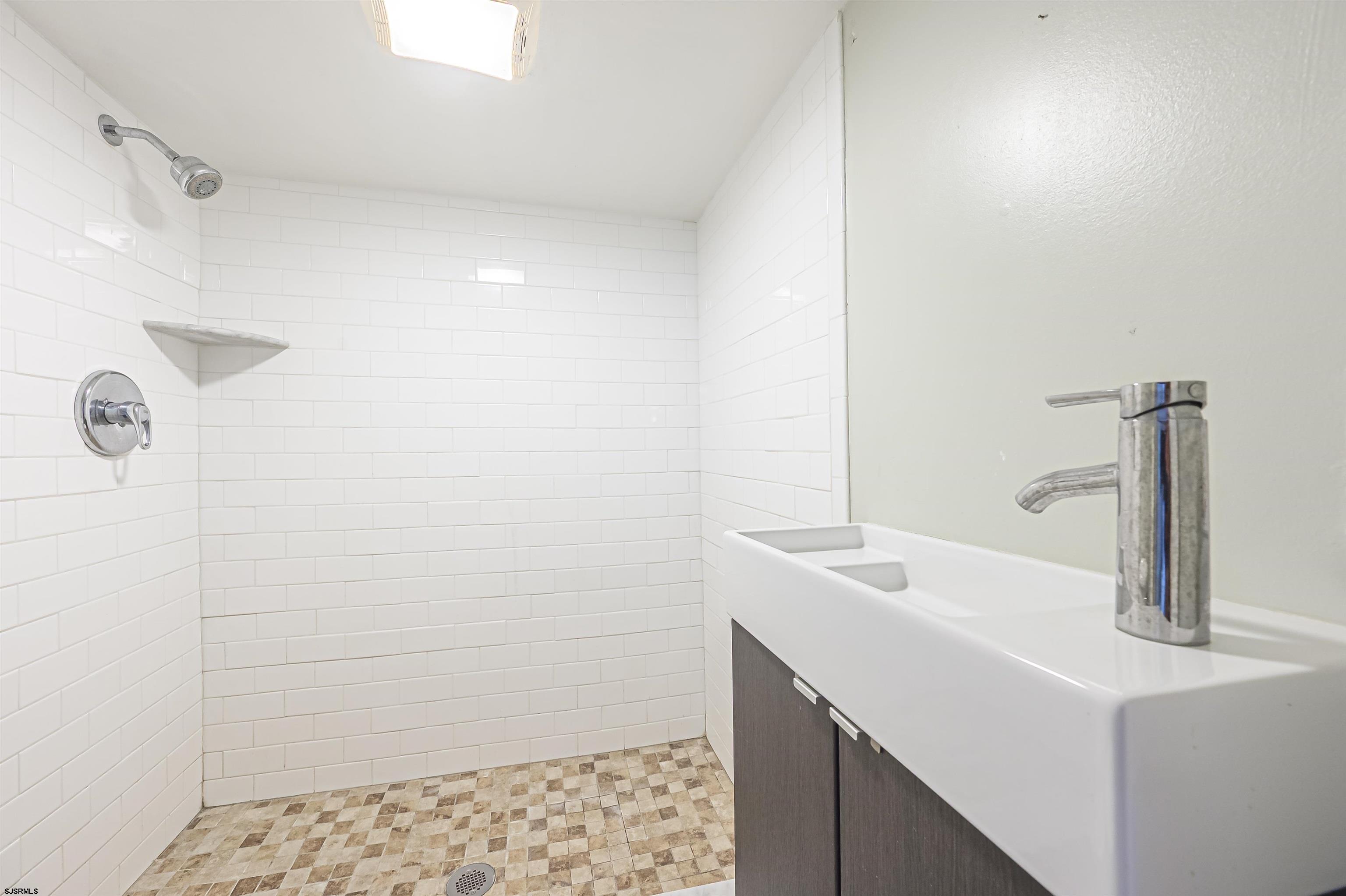 116 North Cornwall Avenue Ventnor City, NJ 08406 - Photo 23 of 28 a bathroom with a sink and a mirror