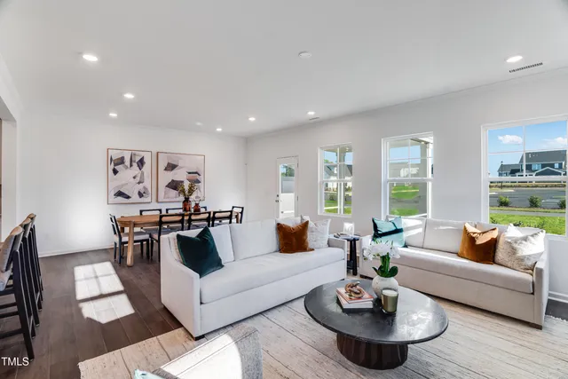 a living room with furniture and a table