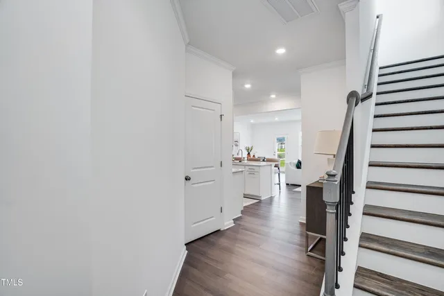 a view of kitchen with sink and wooden floor