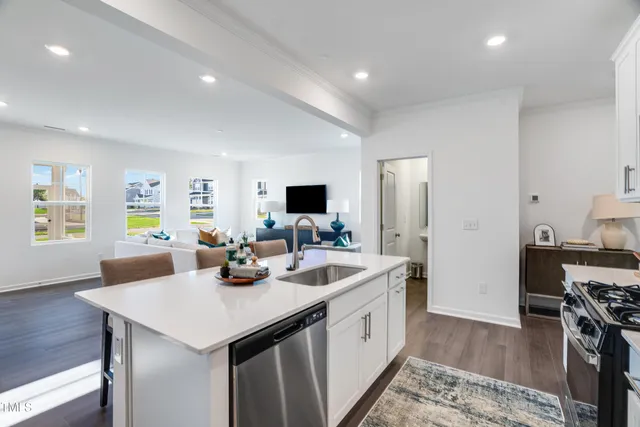 a kitchen with a sink and appliances