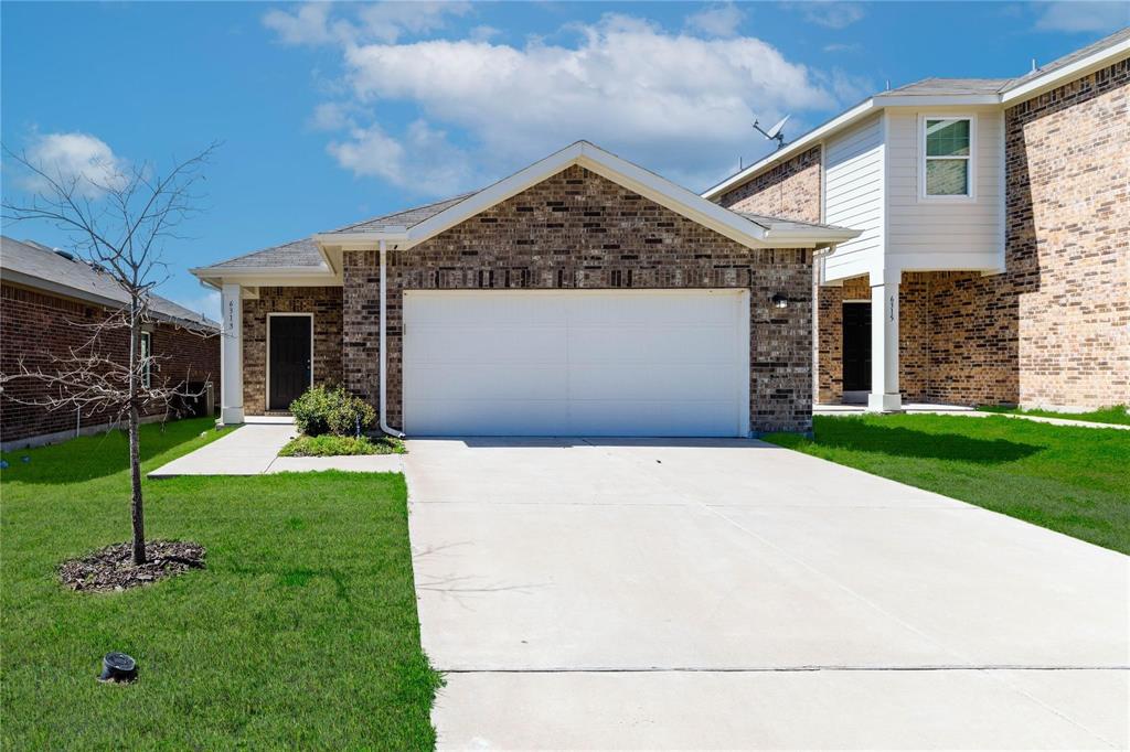 6313 Tropicana Forney, TX 75126 - Photo 1 of 1 a front view of a house with a yard