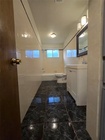 a bathroom with a sink a mirror and a shower