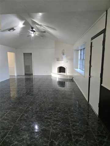 a view of a back yard from a room