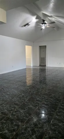 a large parking space with wooden floor