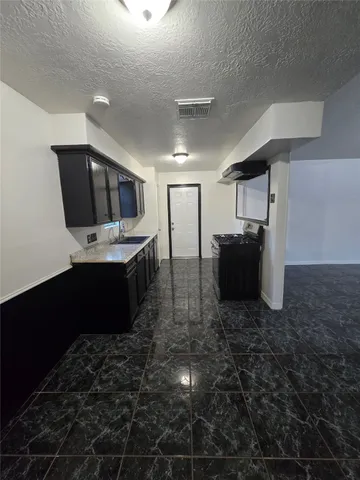 a view of hallway with wooden floor