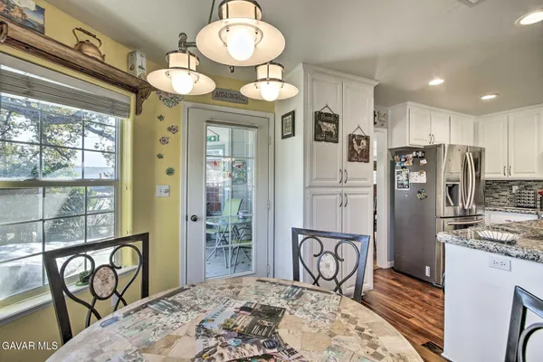 a view of a kitchen and dining area with chandelier