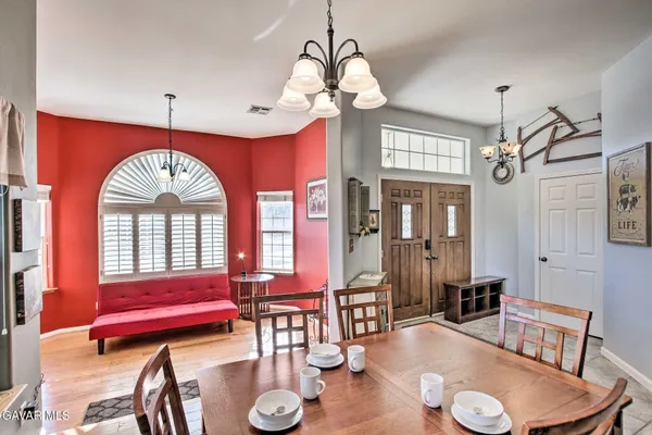 a view of a livingroom with furniture window and wooden floor
