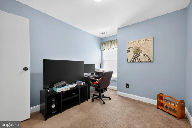 a view of workspace with lounge chair