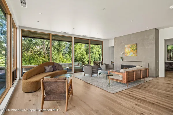 a living room with furniture and a large window