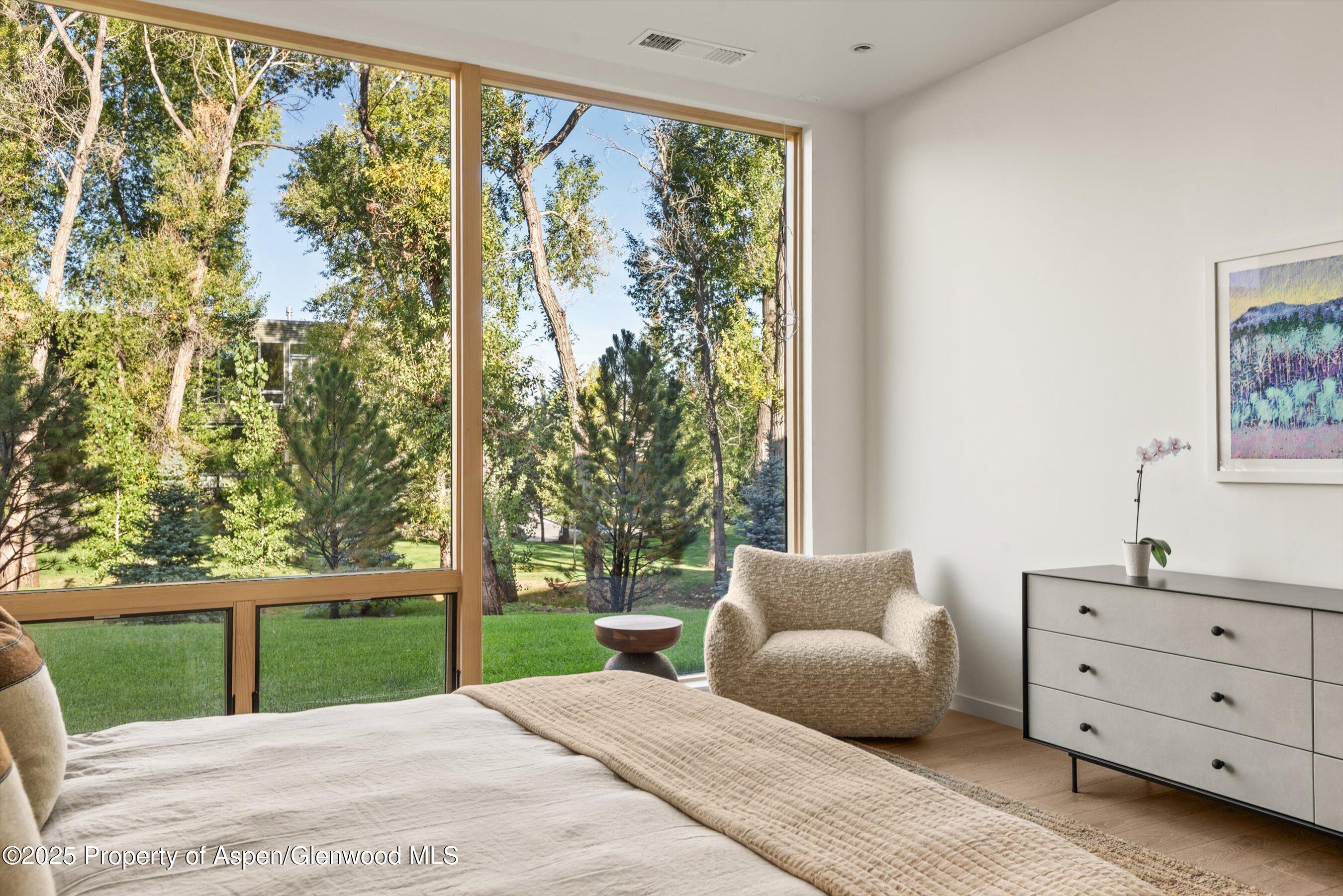 103 Willow Road, Unit 107 Basalt, CO 81621 - Photo 16 of 23 a bedroom with a bed and a window