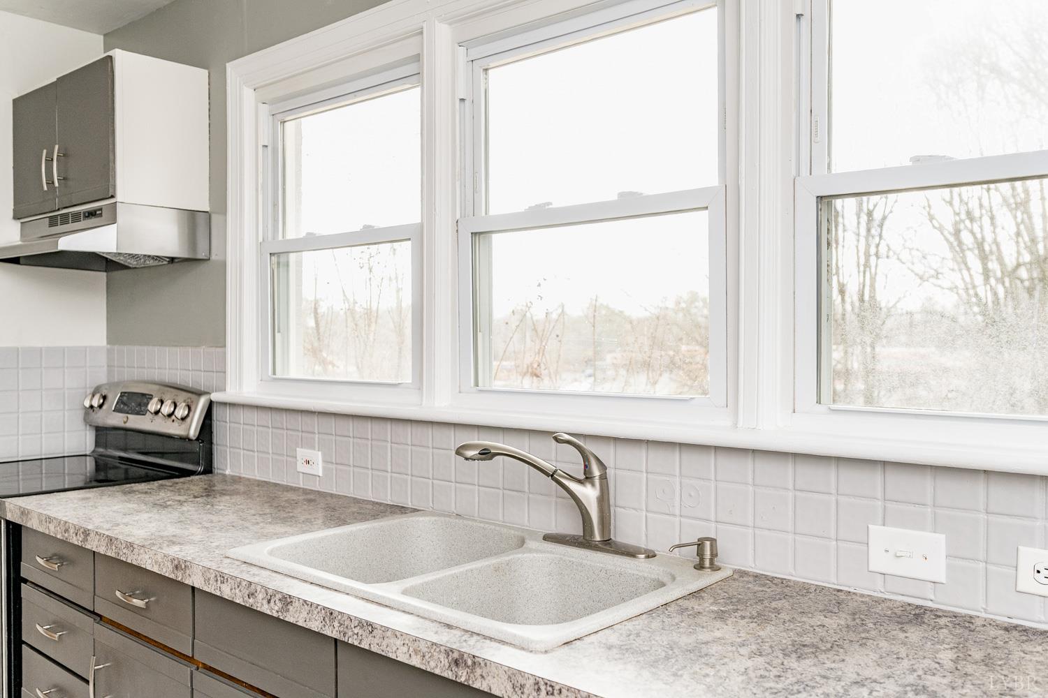 4925 Old Boonsboro Road Lynchburg, VA 24503 - Photo 16 of 57 a kitchen with a sink a counter top space and appliances
