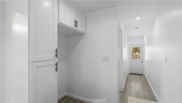 a view of an entryway with a hallway