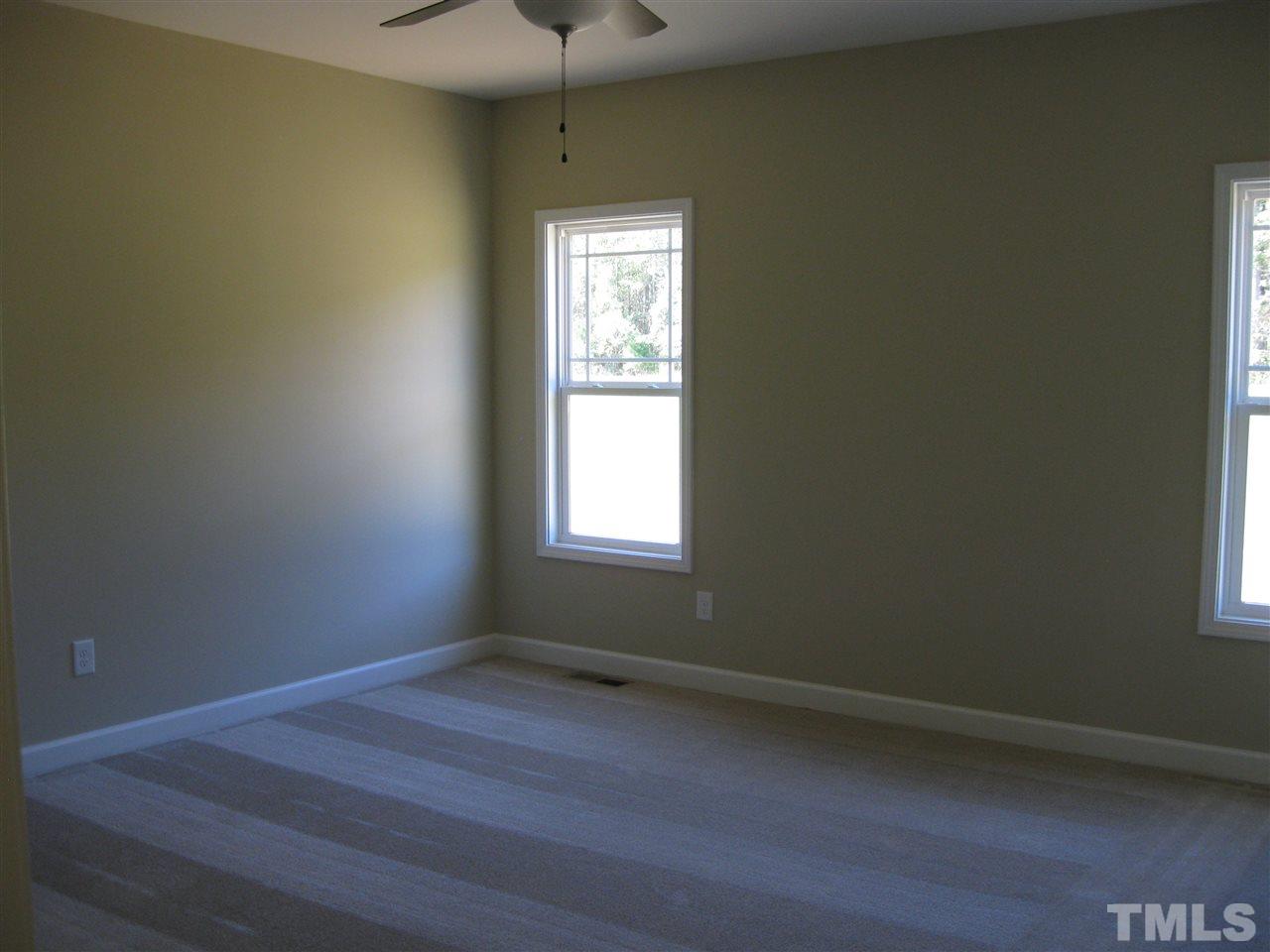7862 Creech Road Middlesex, NC 27557 - Photo 8 of 12 an empty room with a window