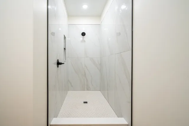 a bathroom with a toilet a sink a vanity and mirror