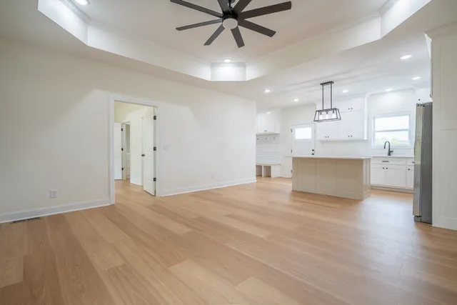 a view of a kitchen with a sink and a window