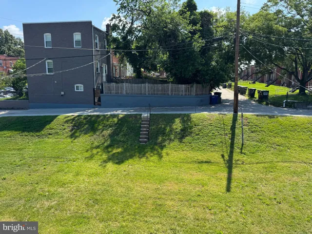 a house view with a play ground
