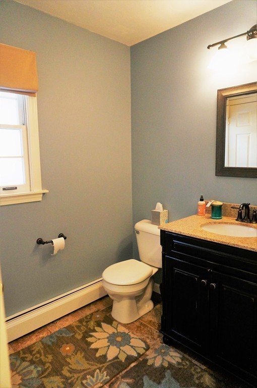 12 Barbara Road Sudbury, MA 01776 - Photo 12 of 26 a bathroom with a granite countertop toilet sink and mirror