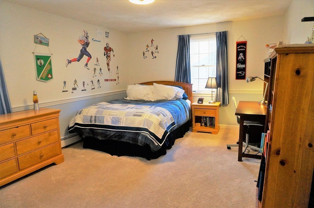 12 Barbara Road Sudbury, MA 01776 - Photo 16 of 26 a spacious bedroom with a bed and dresser