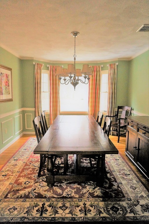 12 Barbara Road Sudbury, MA 01776 - Photo 5 of 26 a large kitchen with a table and chairs