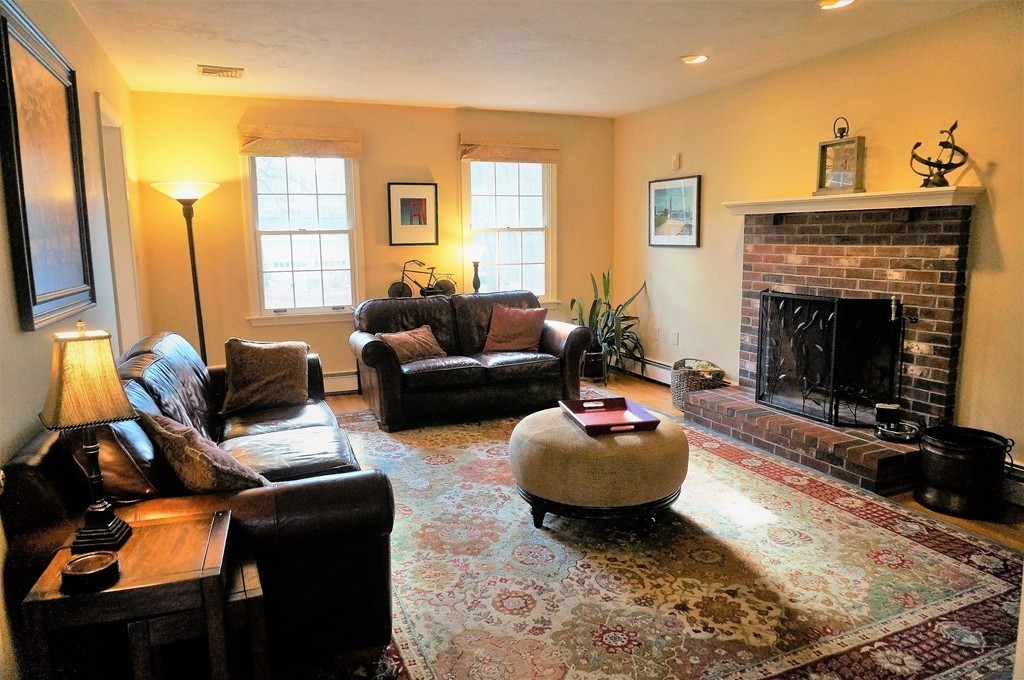 12 Barbara Road Sudbury, MA 01776 - Photo 10 of 26 a living room with furniture and a fireplace
