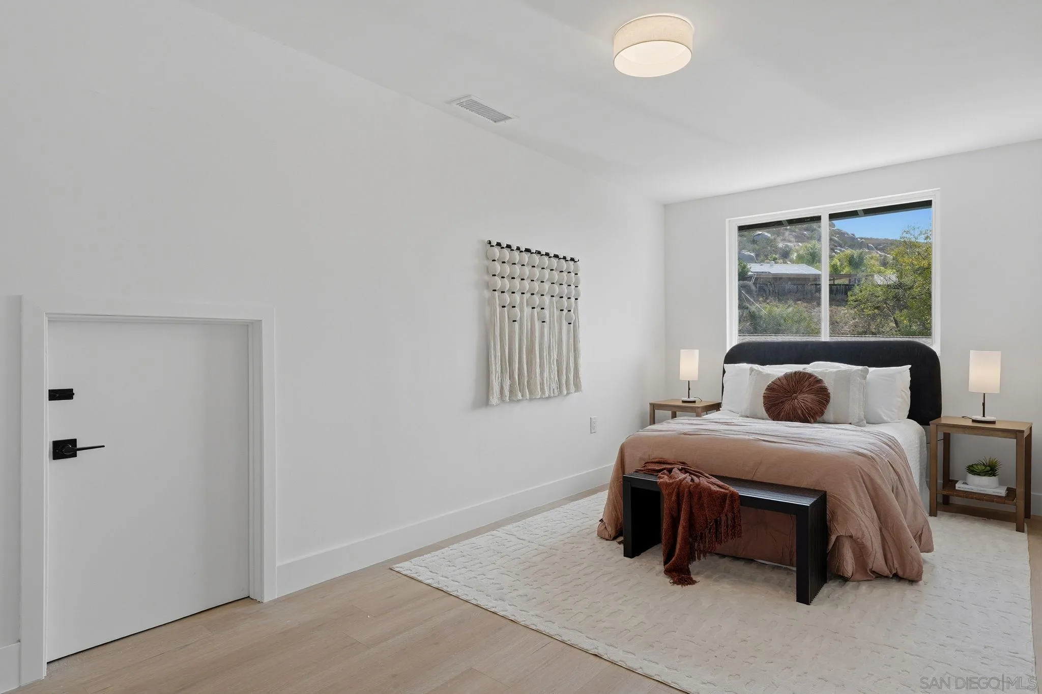 10440 Bosque Drive Lakeside, CA 92040 - Photo 39 of 47 a bedroom with a bed and a window