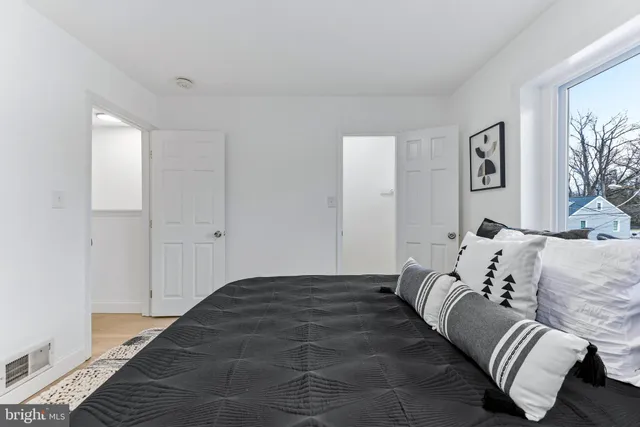 a view of room with window and wooden floor