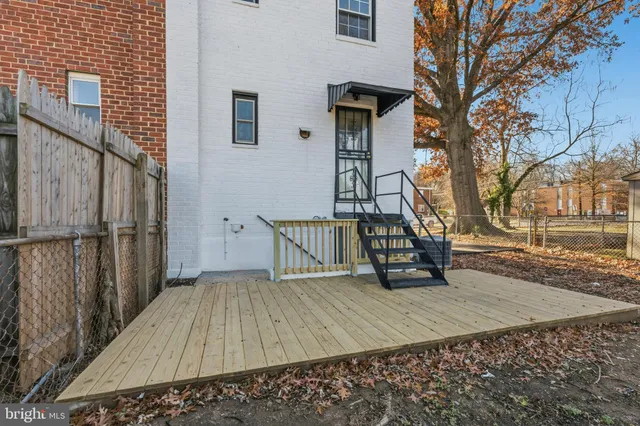 an aerial view of a residential apartment building with a yard