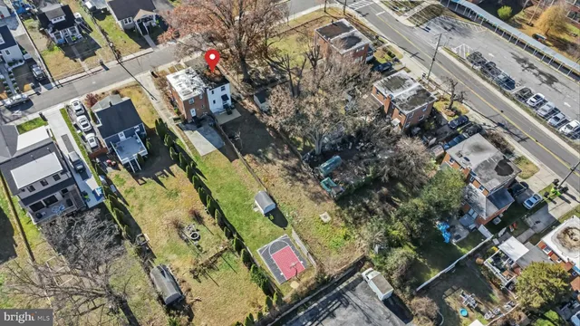 a view of a house with snow on the road